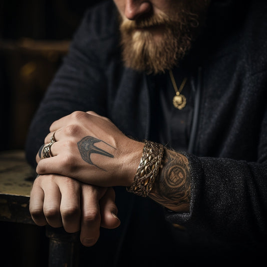 nordic man sitting and displaying bracelet